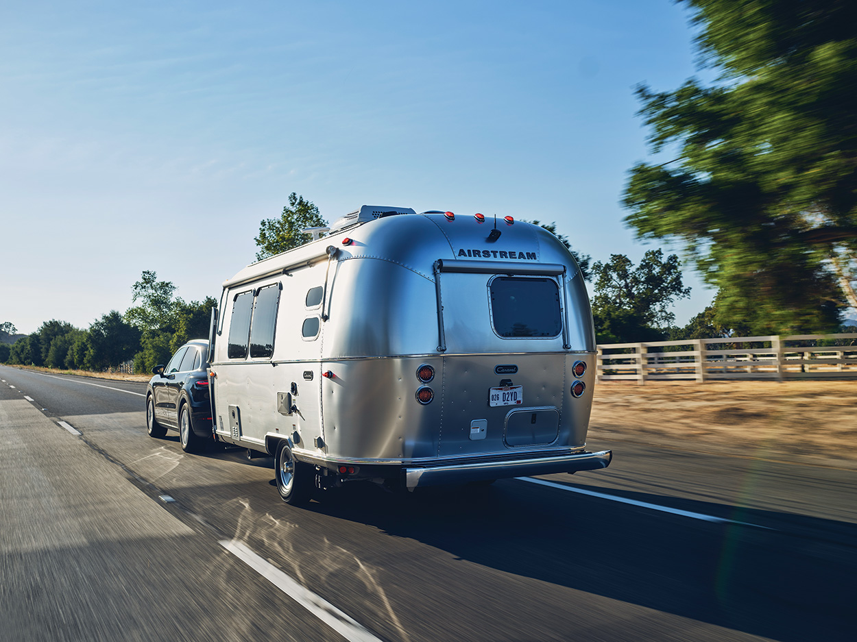 The Escape Pod: A Cayenne e-Hybrid towing an airstream trailer pulls a ...