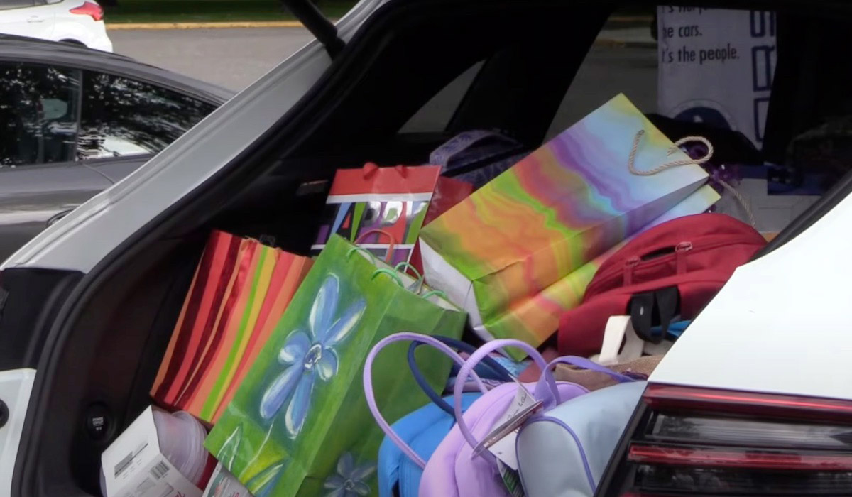 photo of Local Porsche club delivers school supplies to Mamas for Mamas image